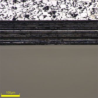 High-magnification (500x) image of the edge of a piston ring groove. You can clearly see that the edge is straight