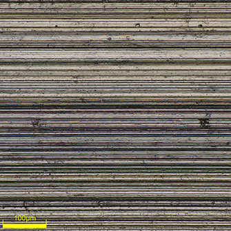 High-magnification (500x) image of the bottom of a piston ring groove. You can closely observe the machined state.