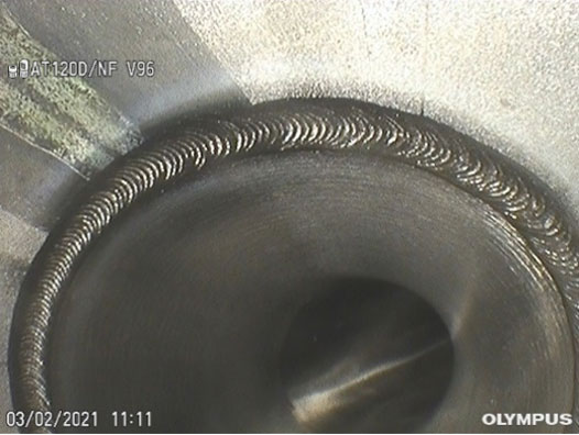 Partial image on an Olympus IPLEX videoscope of weld in stainless steel process pipe in a drug manufacturing plant using a 120-degree wide angle lens tip adaptor