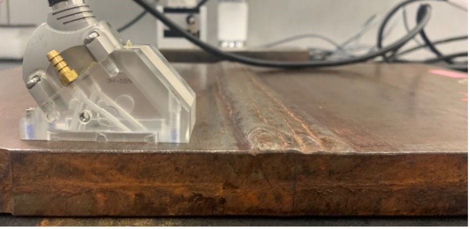 Phased array A32 probe on a 25 mm thick weld test standard with a single V weld.