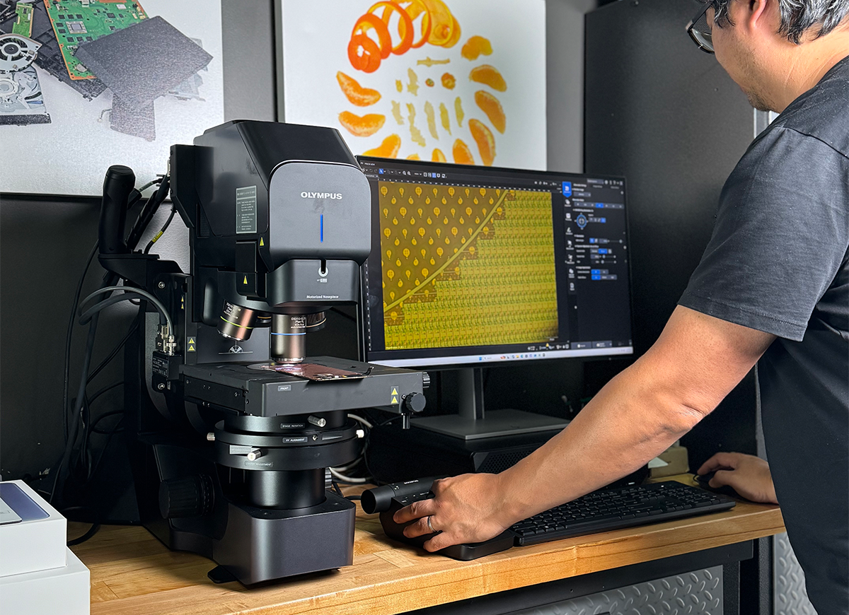 Arthur Shi at work on the DSX2000 digital microscope during a phone teardown.