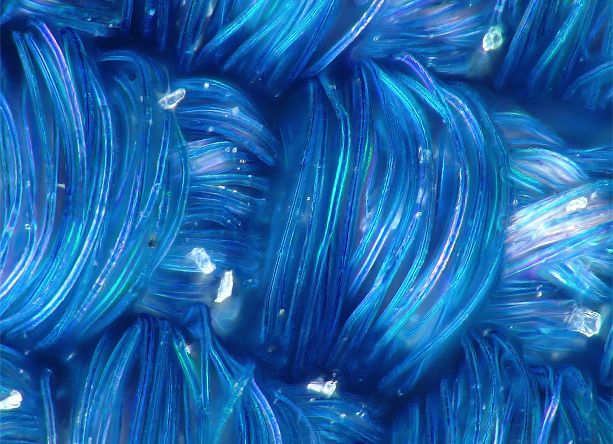 FineWoven is an open and unsealed weave that lets liquids soak into the fibers.