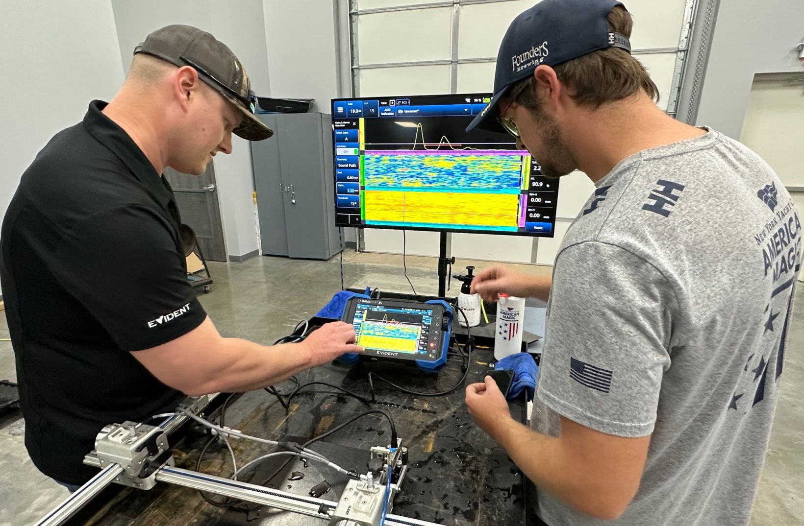 An Evident Application Engineer team member demonstrates a composite inspection solution during an on-site session