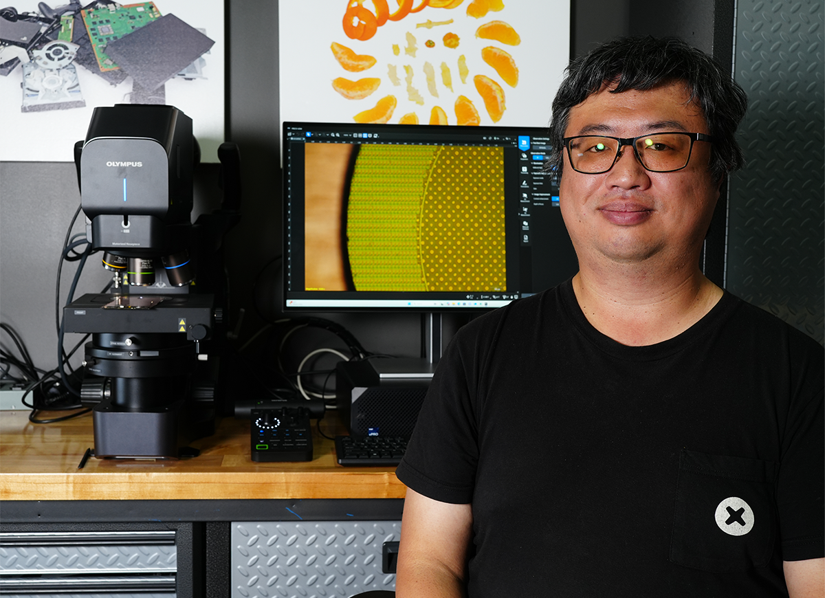 Arthur Shi at the DSX2000 digital microscope in iFixit's teardown lab.