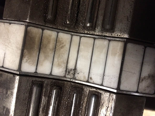 Ceramic face of an ECA probe showing minor abrasions post testing